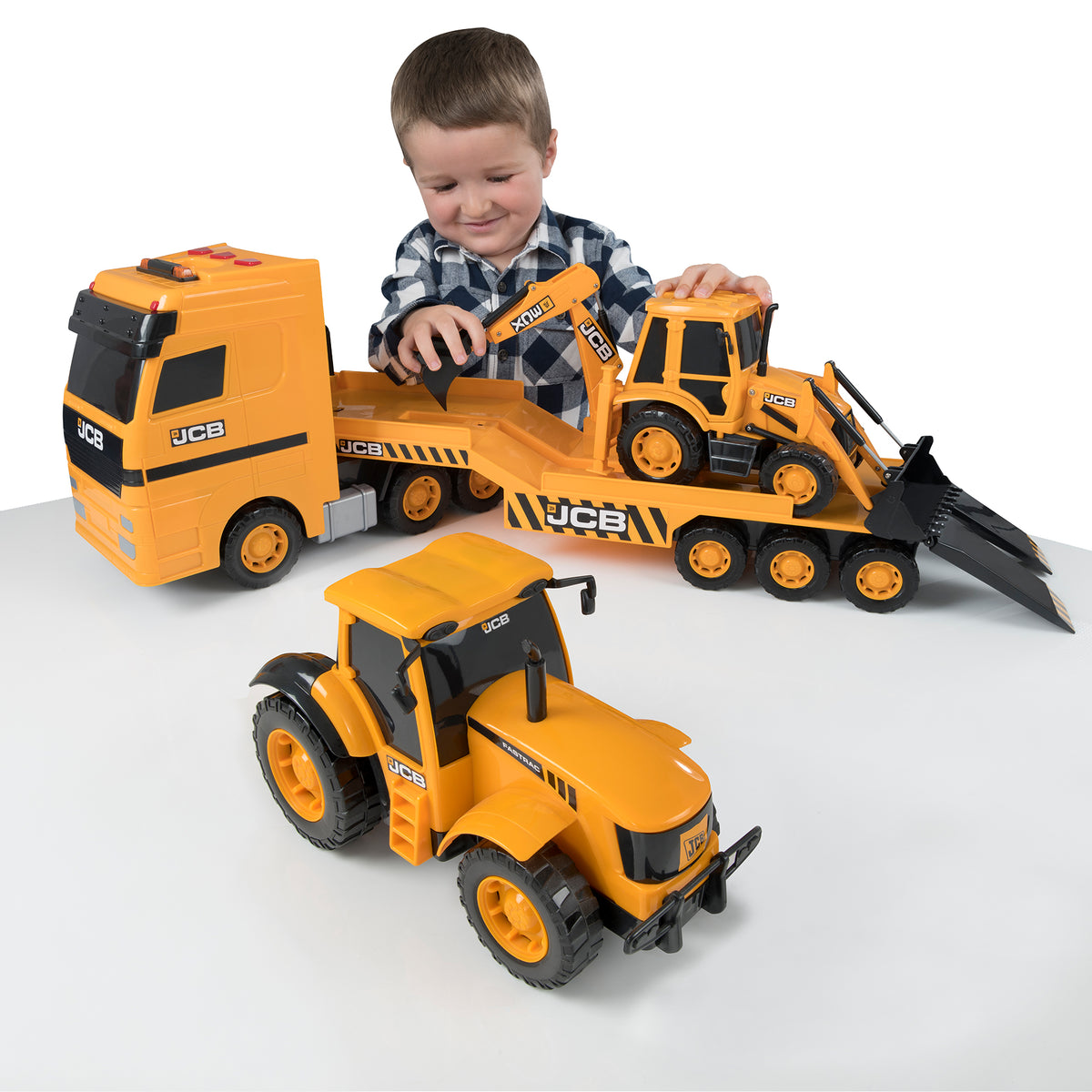 image of  a child playing with the JCB Heavy Loader Transporter from Teamsterz HTI