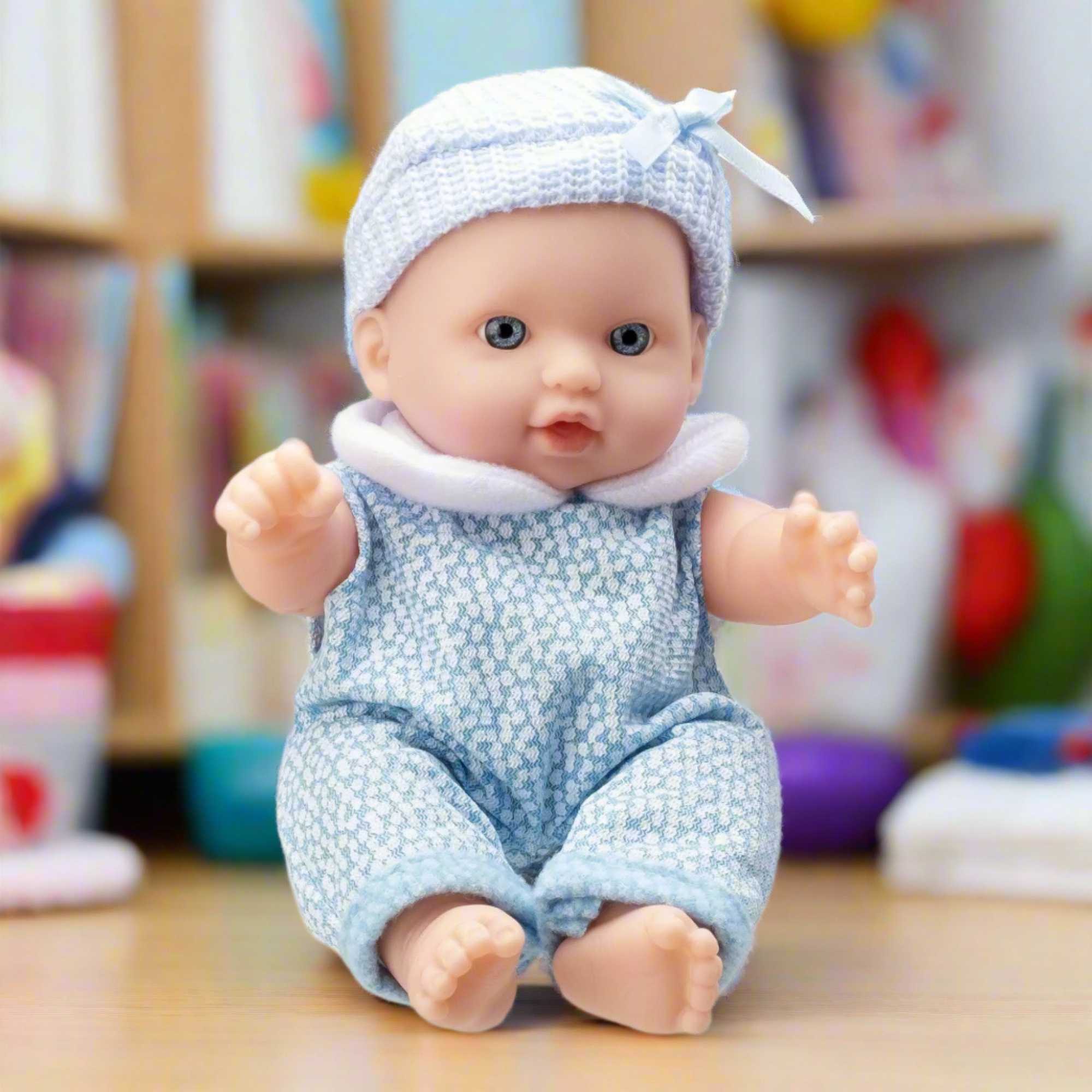 BabyBoo Cutie Baby Doll available in blue and pink outfits, featuring a soft, cuddly body, lifelike facial features, and gentle expression, perfect for nurturing role-play and snuggling.