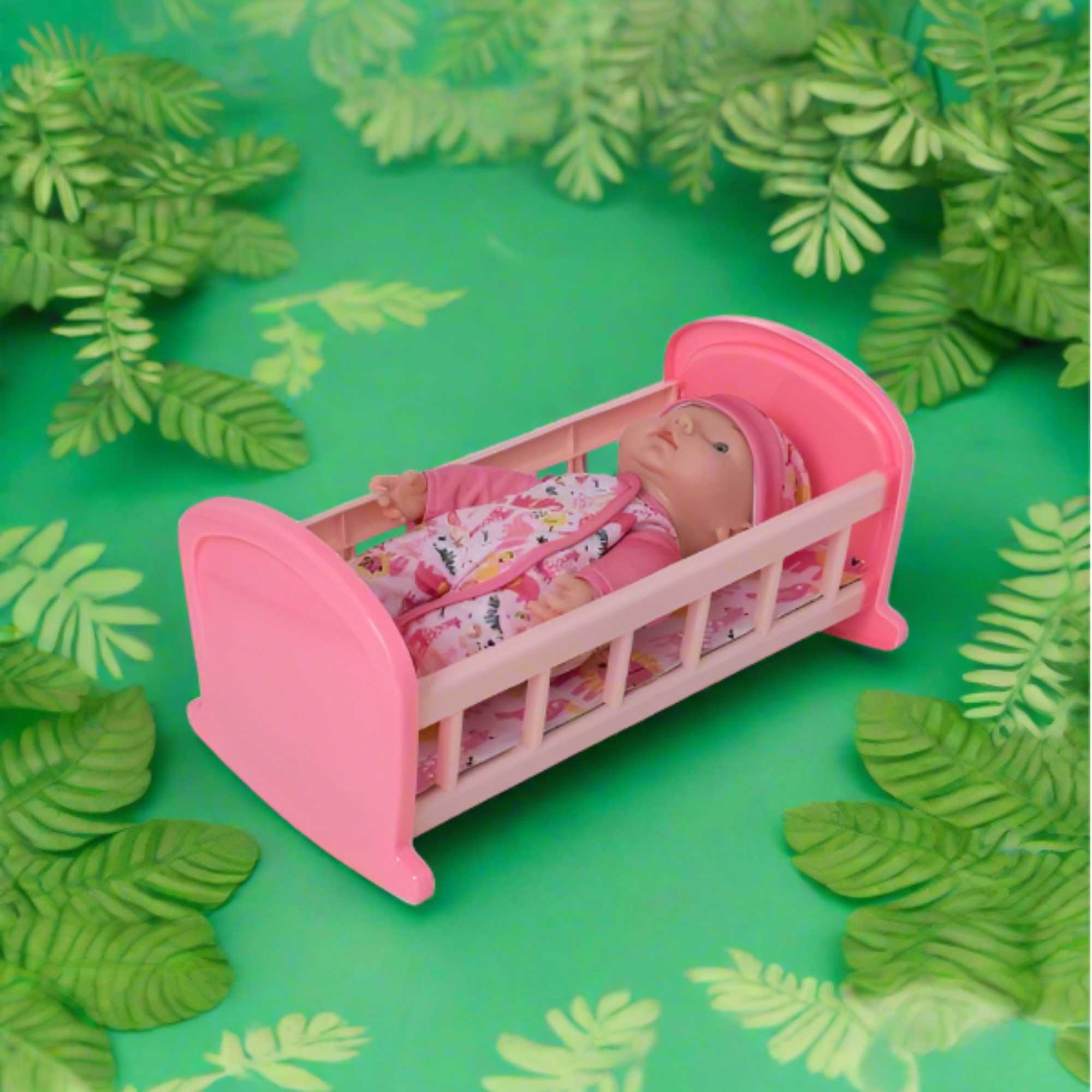 Complete with included doll, this charming cot offers a cozy resting place for dolls, fostering imaginative play and nurturing skills in children