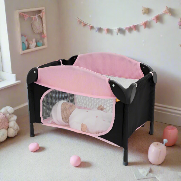 Joie Sleep & Dream Dolls Travel Cot, a compact and foldable design in pink and grey, featuring breathable mesh sides and a sturdy frame, ideal for children to use for their dolls during playtime and travel