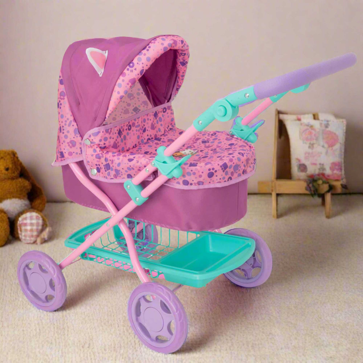Adorable and colourful toy pram inspired by Gabby&#39;s Dollhouse, perfect for children to transport their favourite dolls and stuffed animals. Features include a sturdy frame, easy-to-push wheels, and playful designs with popular characters from the show. 