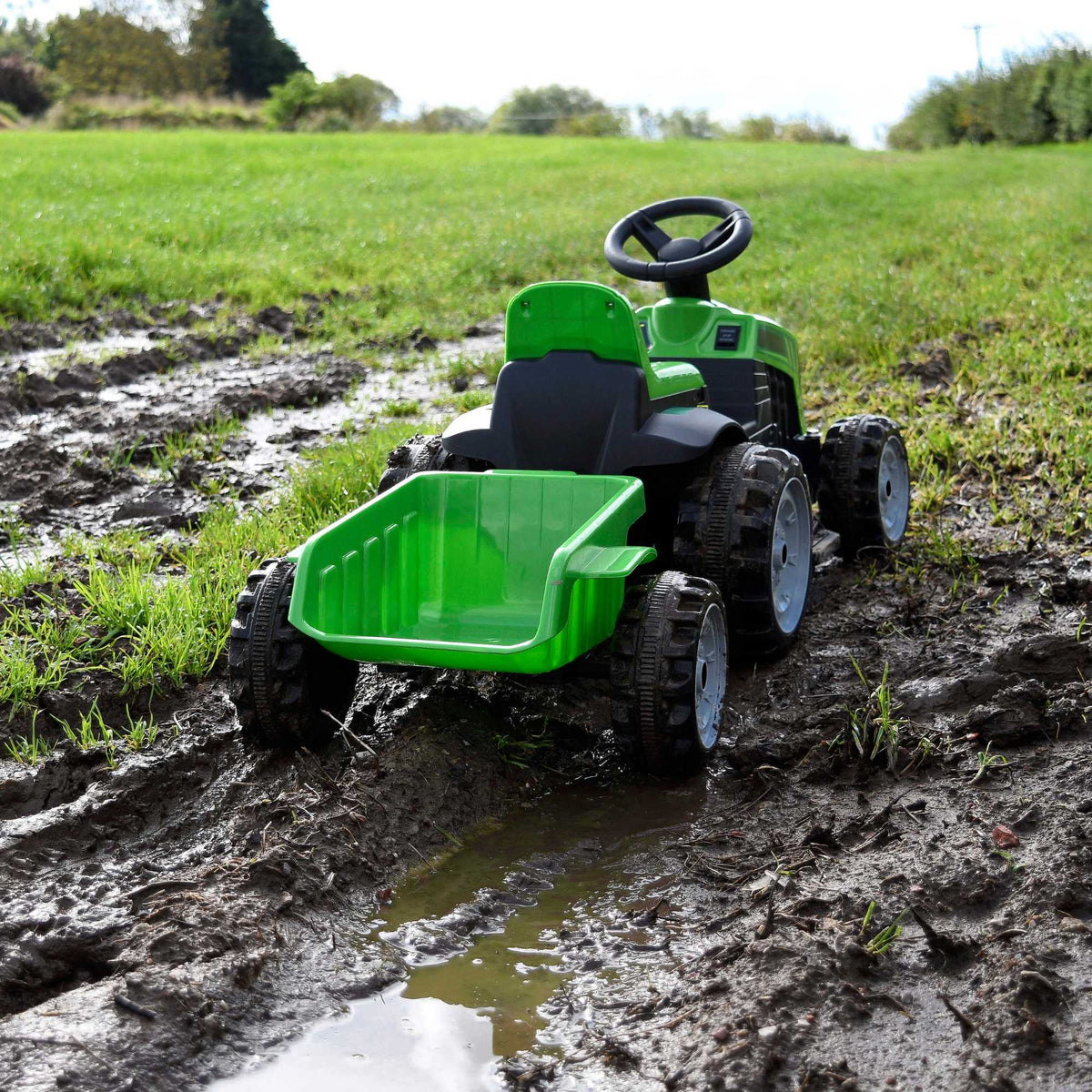 Electric green EVO Green Tractor &amp; Trailer Ride-On for 2-year-olds, featuring a realistic tractor design, detachable trailer, ergonomic seat, and easy-to-use controls for safe and fun farmyard adventures.