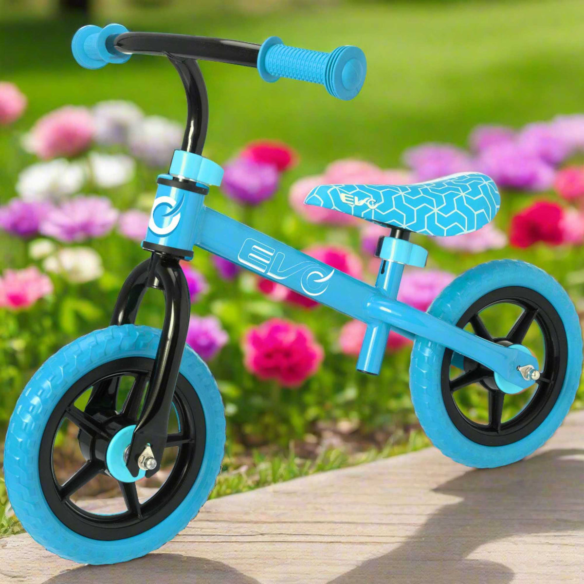 Child riding the EVO Balance Bike outdoors, showcasing the lightweight and durable design perfect for young learners to develop their balance and coordination skills