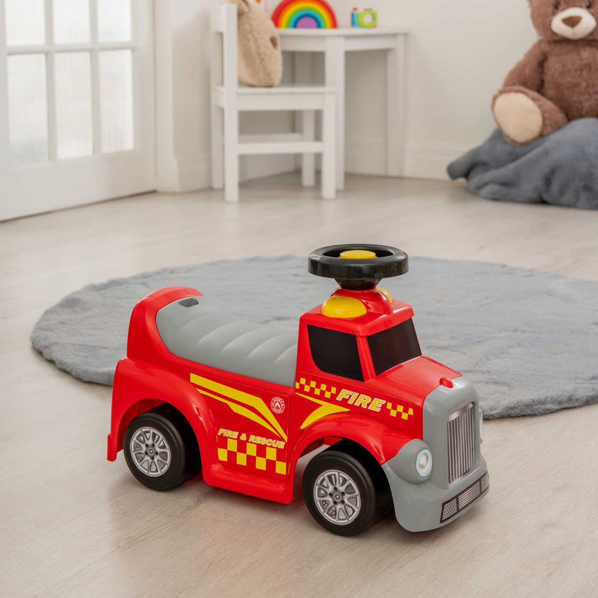 EVO Foot 2 Floor Ride-On Fire Engine for children aged 1 and up, featuring a vibrant red design, wide wheelbase, and foot-to-floor propulsion for safe and imaginative play.