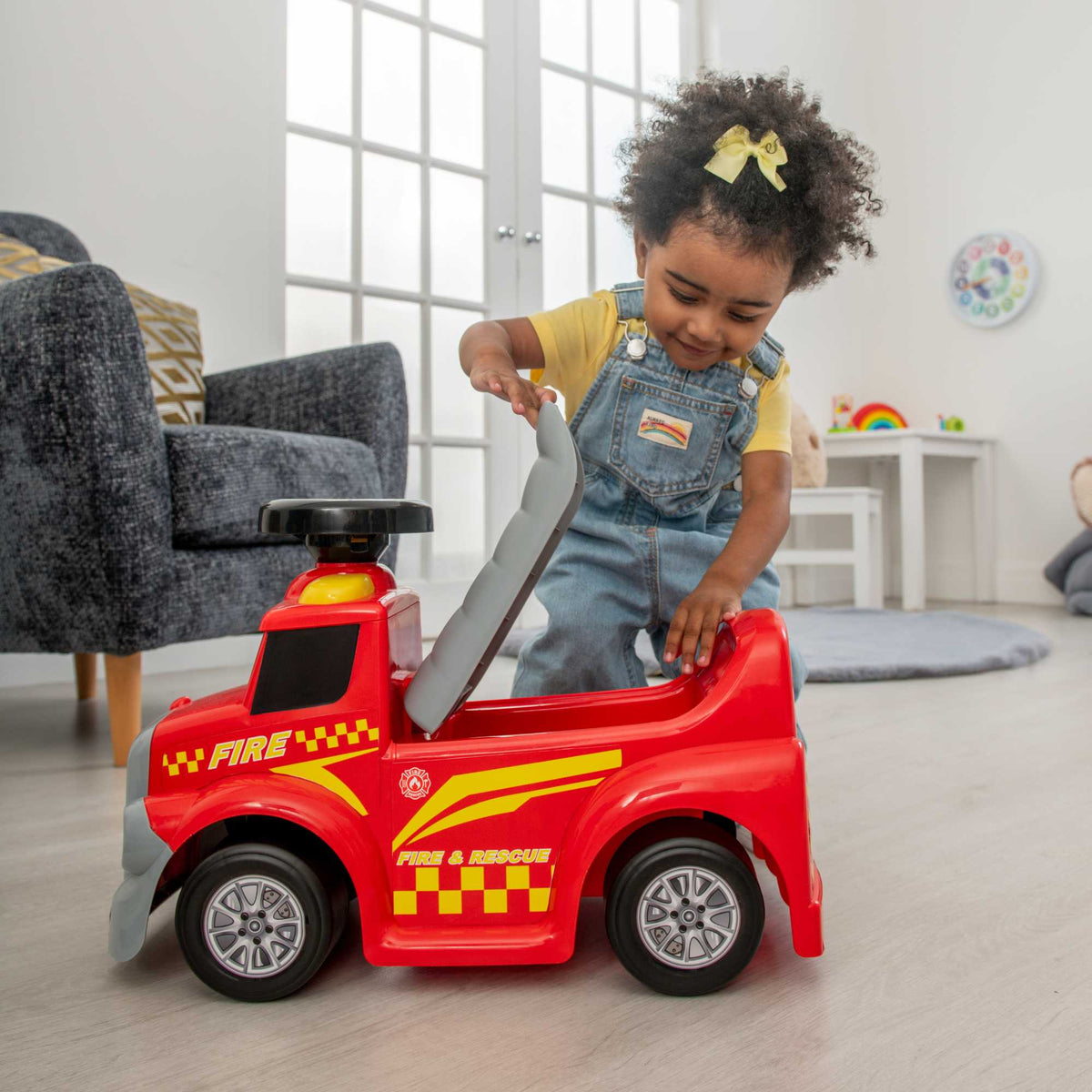 EVO Foot 2 Floor Ride-On Fire Engine for children aged 1 and up, featuring a vibrant red design, wide wheelbase, and foot-to-floor propulsion for safe and imaginative play.