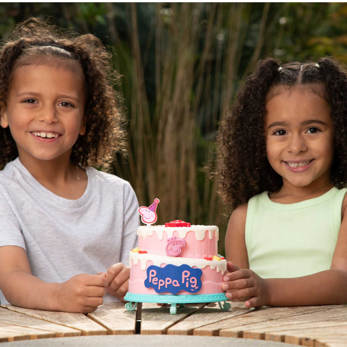 Peppa Pig Birthday Cake Bubble Machine featuring fun cake design, blowing bubbles for kids&#39; parties, playdates, and outdoor activities, perfect for Peppa Pig fans.