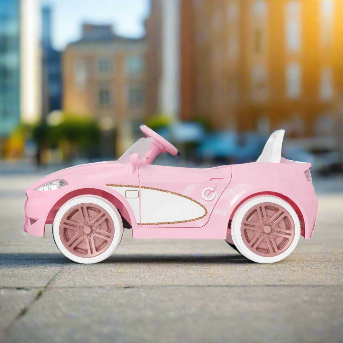 Pink EVO Dream Coupe Car Ride-On Toy for children aged 3+, featuring pedal-driven forward and reverse motion, working headlights, and authentic engine and horn sounds