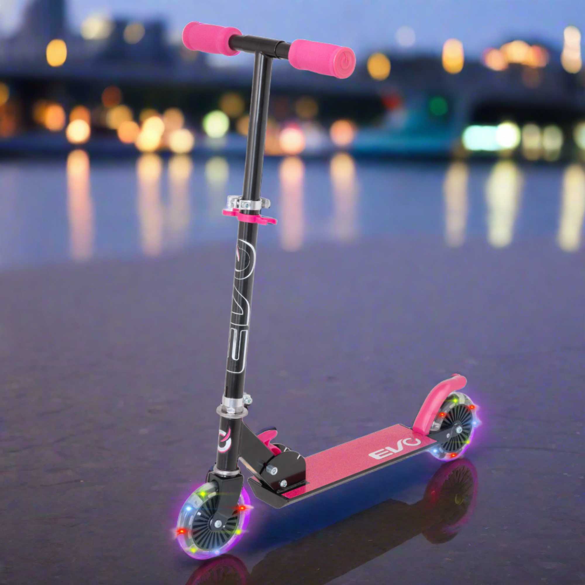 EVO Children's Light Up Inline Scooter for Kids Ages 5 and Up with LED Wheels and Adjustable Handlebar, perfect for enhancing motor skills and outdoor fun.