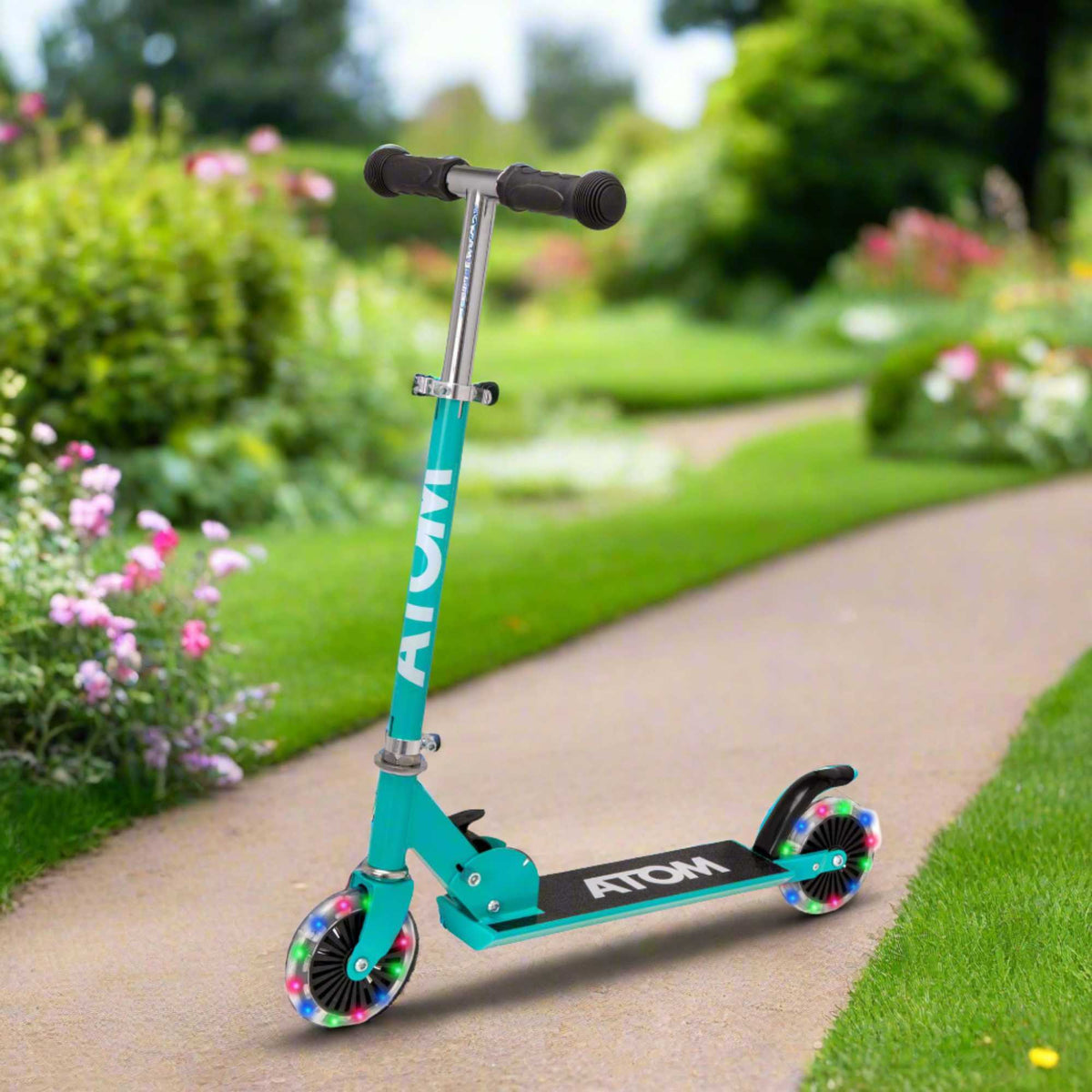 ATOM Inline Children&#39;s Kick Scooter in bright colours, designed for kids with a sturdy frame, adjustable handlebars, and smooth-rolling wheels, perfect for outdoor fun and active play.