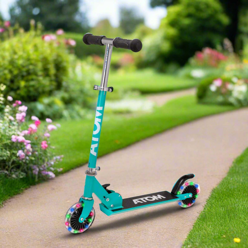 ATOM Inline Children's Kick Scooter in bright colours, designed for kids with a sturdy frame, adjustable handlebars, and smooth-rolling wheels, perfect for outdoor fun and active play.