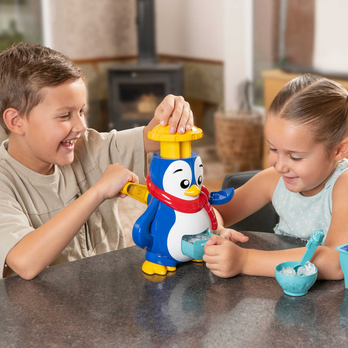 Polar Penguin Ice Maker Toy Set featuring a penguin-shaped ice crusher, ice lolly moulds, ice cube tray, and a bottle for syrups. Perfect for kids, this fun and educational set allows them to create delicious frozen treats, promoting creativity and learning about the science of freezing. 