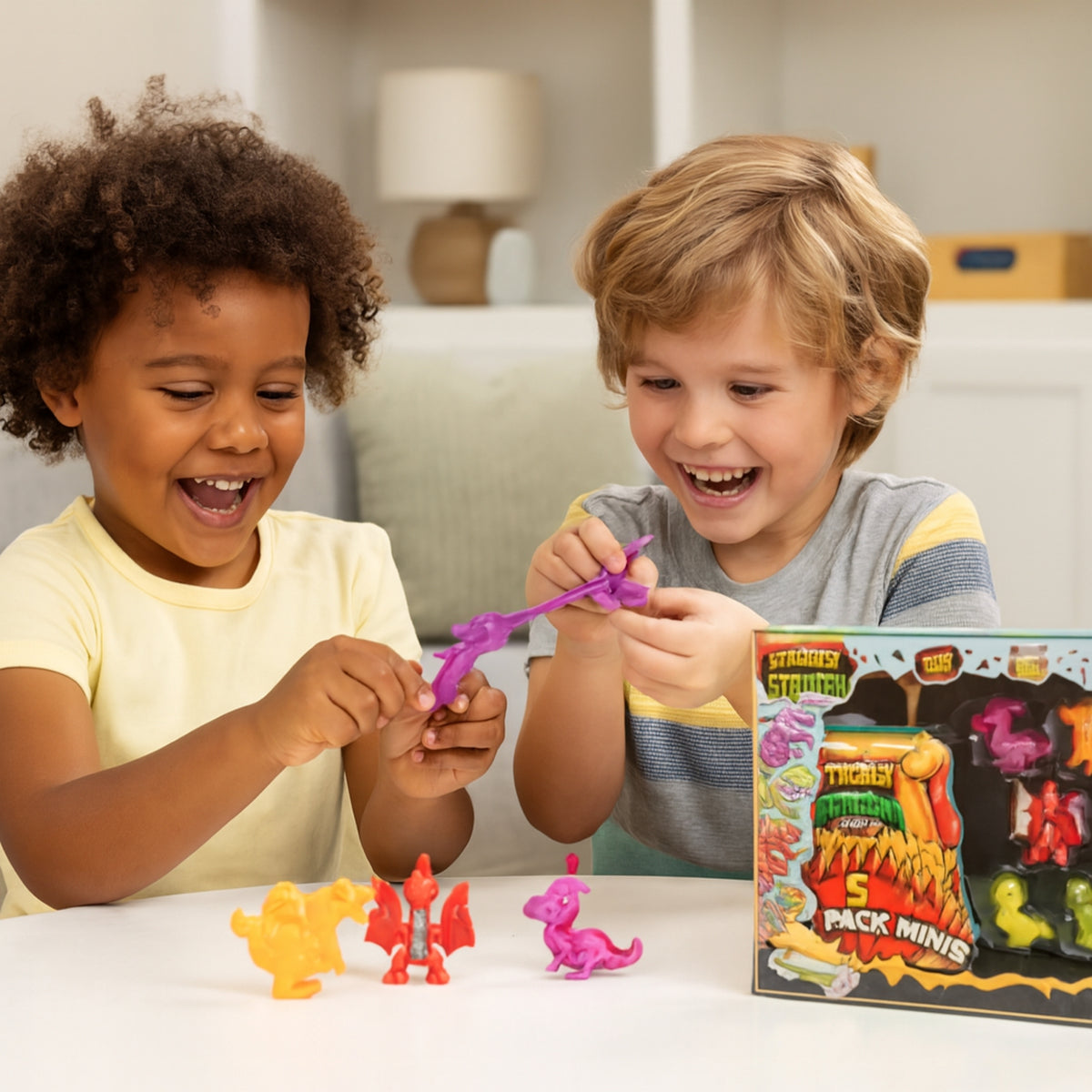 Two children playing with toy figures in front of a box labeled &#39;5 Pack Minis&#39;.