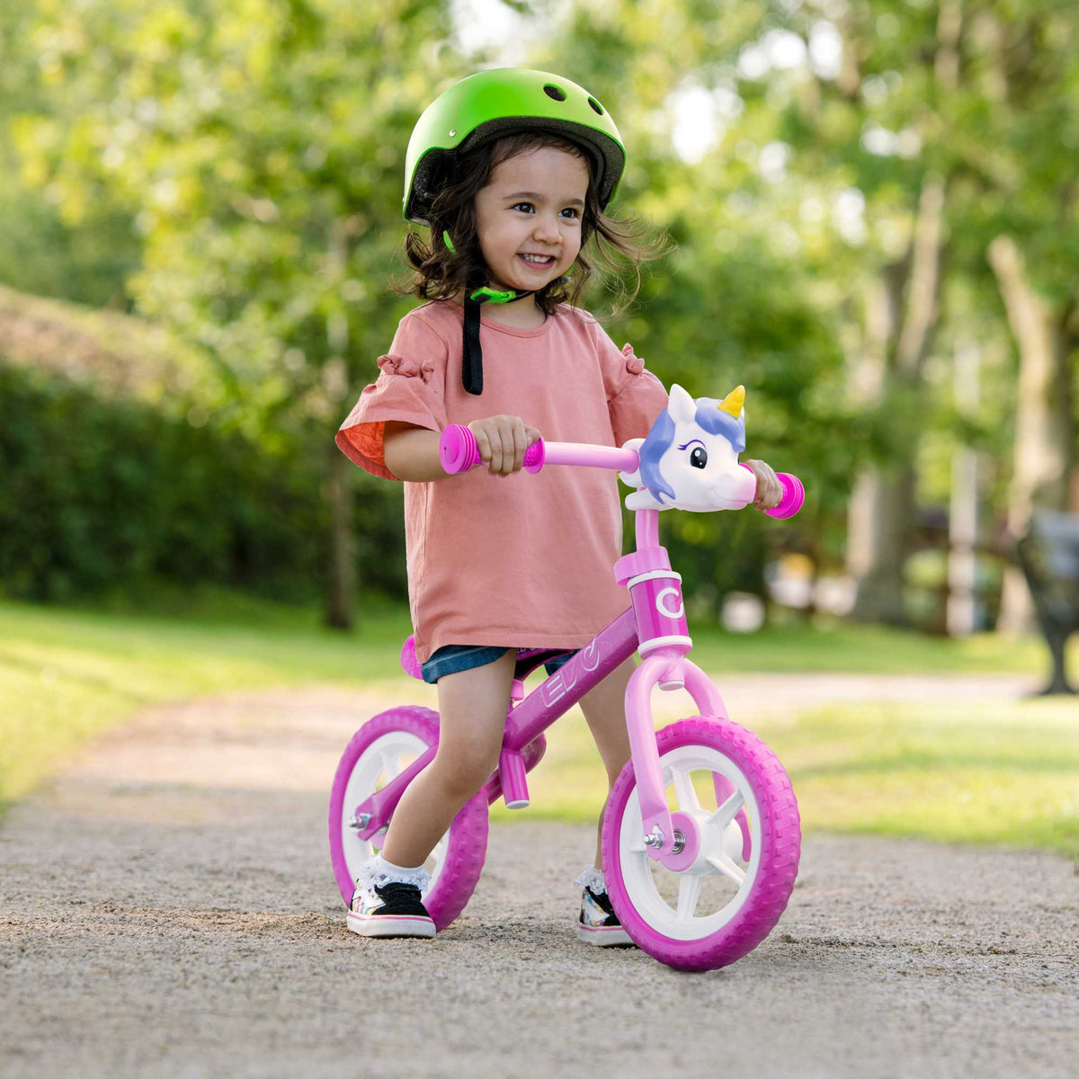 Child riding the EVO Balance Bike outdoors, showcasing the lightweight and durable design perfect for young learners to develop their balance and coordination skills