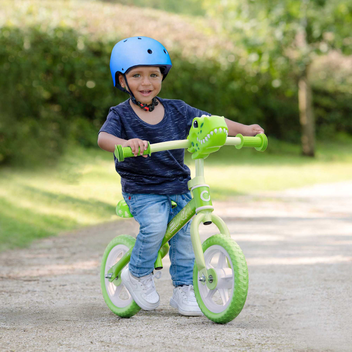 Child riding the EVO Balance Bike outdoors, showcasing the lightweight and durable design perfect for young learners to develop their balance and coordination skills