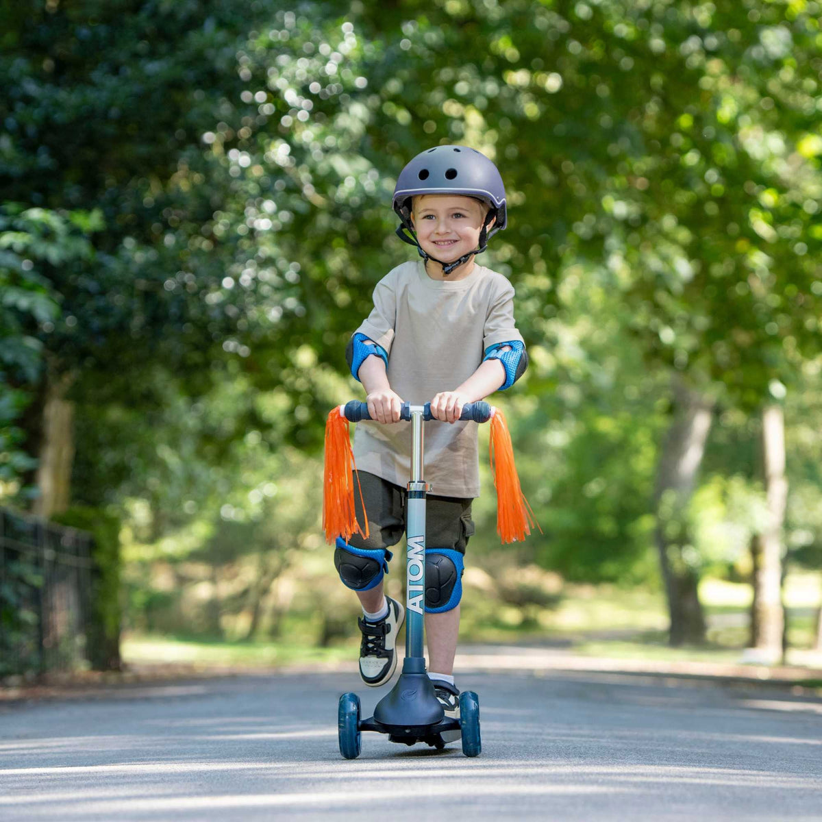 ATOM Eclipse Light-Up Scooter in Solar Design – Kids 3-Wheel Scooter with LED Deck and Flashing Wheels for Ages 5+.