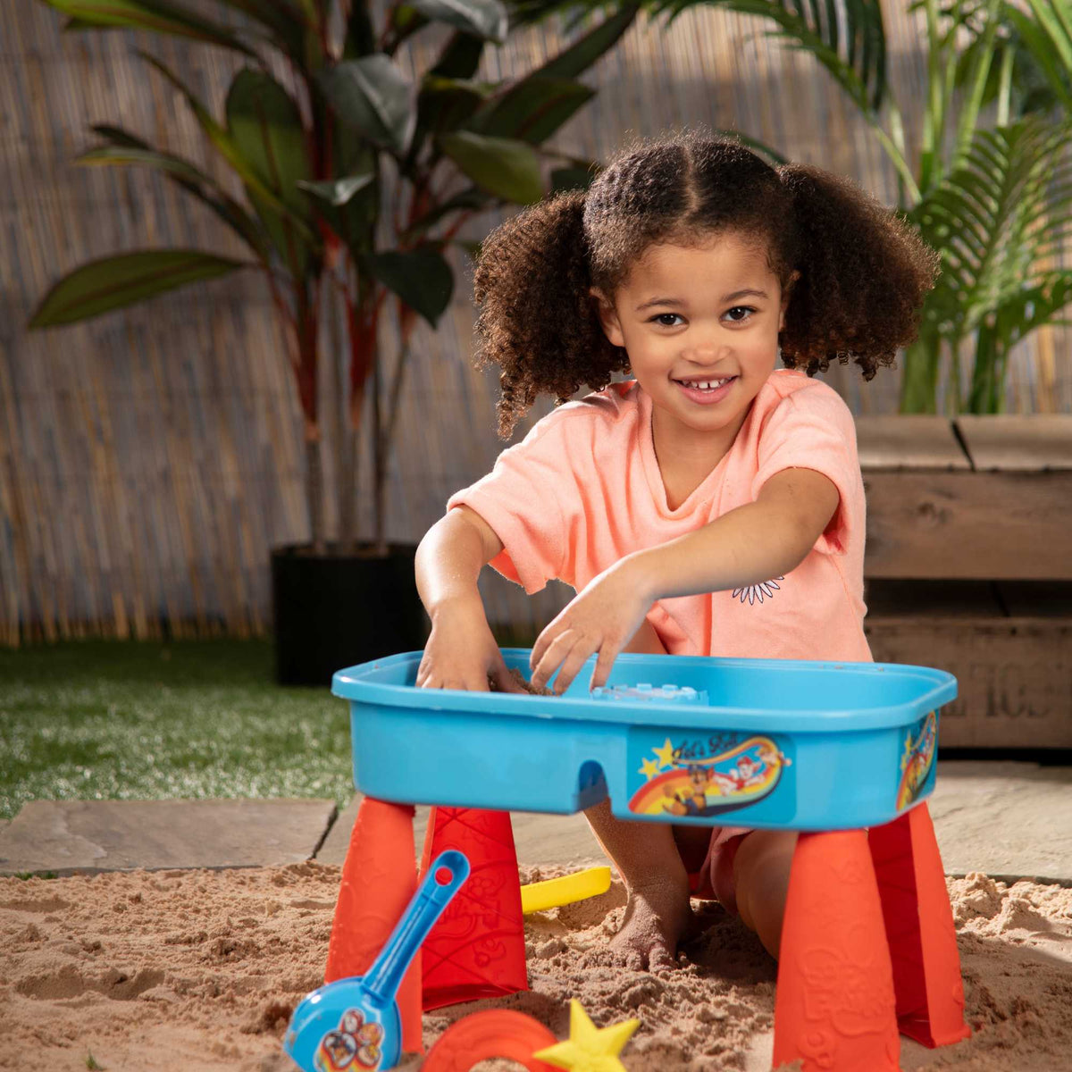 Paw Patrol Sand &amp; Water Play Table with accessories for kids, featuring sand and water compartments, perfect for outdoor play and Paw Patrol-themed adventures.