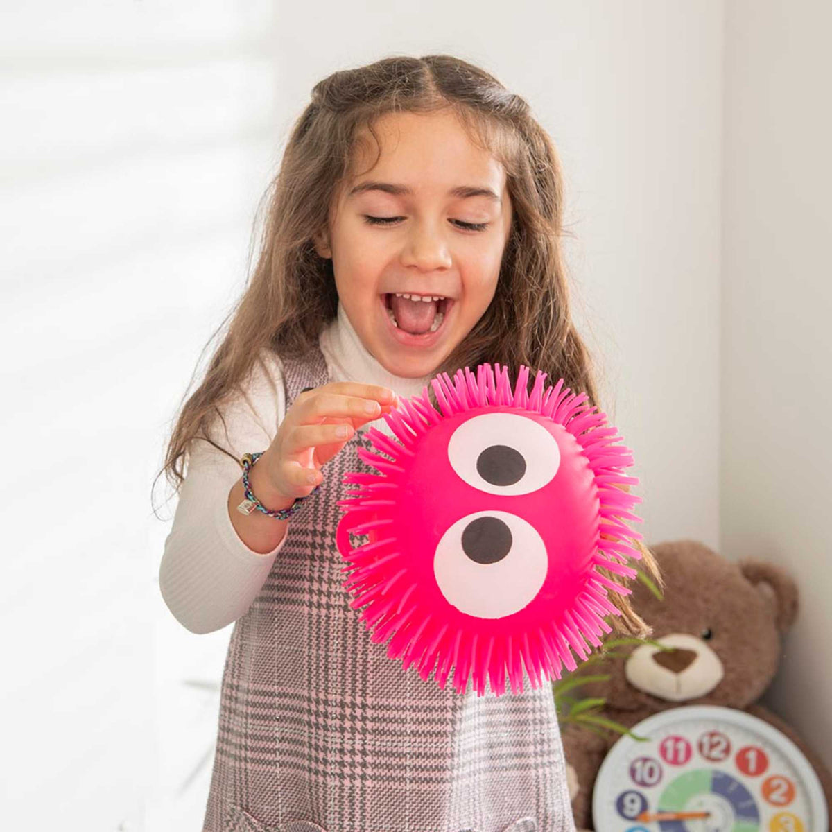 Collection of Fluffeez Balls in a display box, featuring 12 soft and fluffy balls in 6 vibrant colours, perfect for play and relaxation