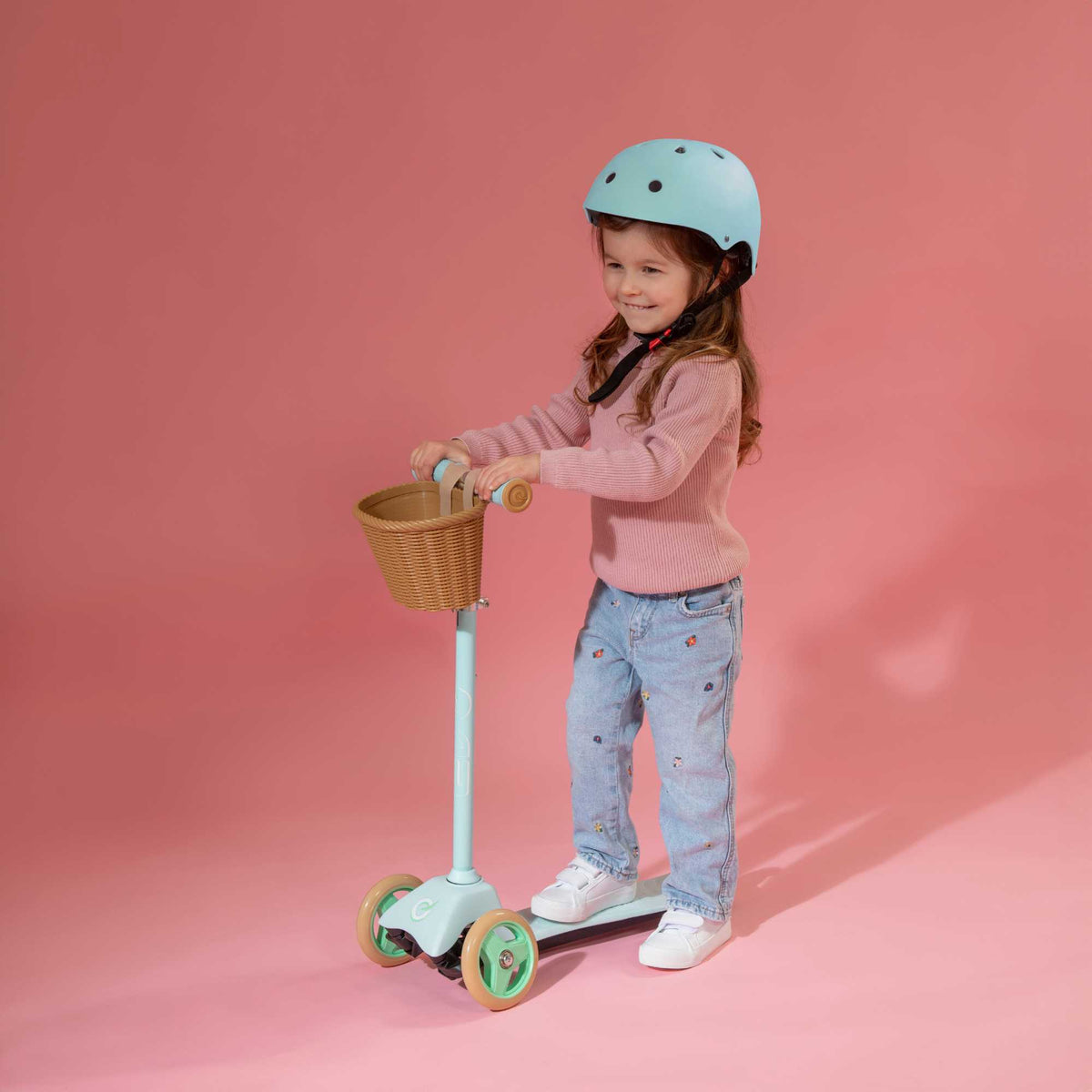 EVO Mini Cruiser Scooter with Basket, featuring a stable three-wheel design, adjustable handlebars, and lightweight, durable construction, perfect for young children’s outdoor adventures.