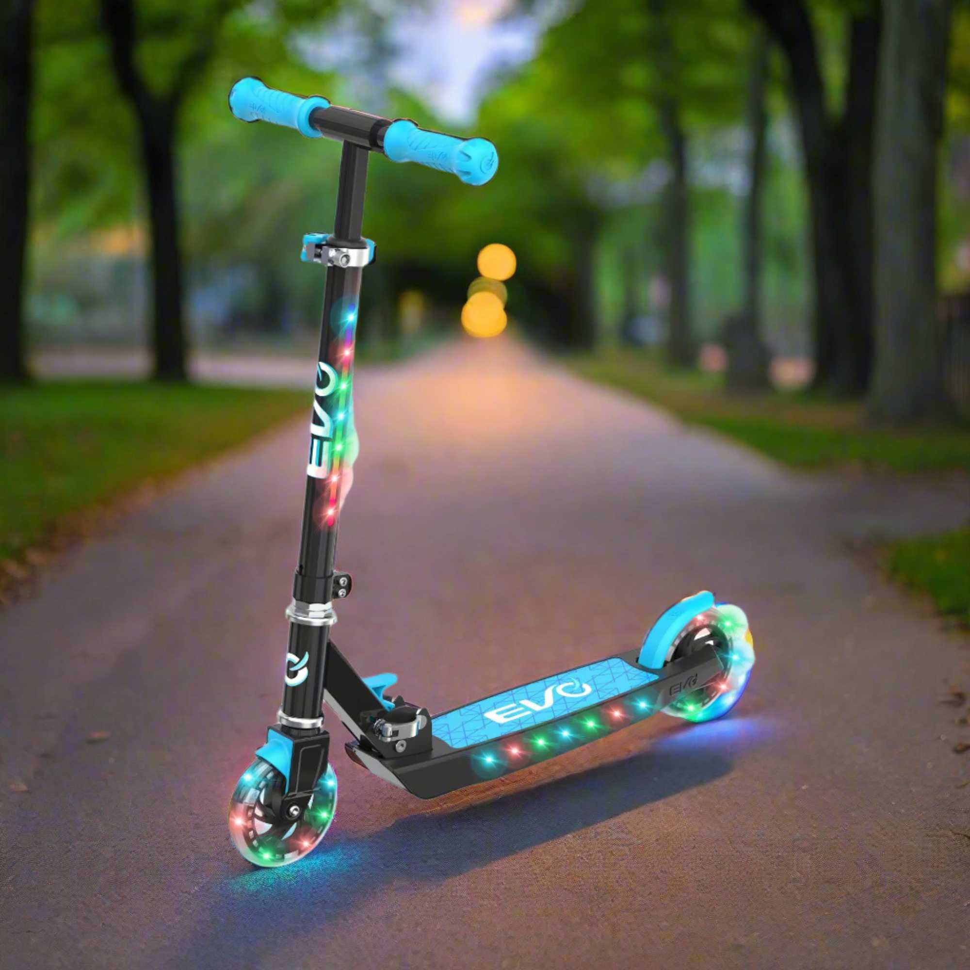 EVO Children's Light Up Light Blast Scooter for Kids Ages 5 and Up with LED Wheels and Adjustable Handlebar , perfect for enhancing motor skills and outdoor fun.