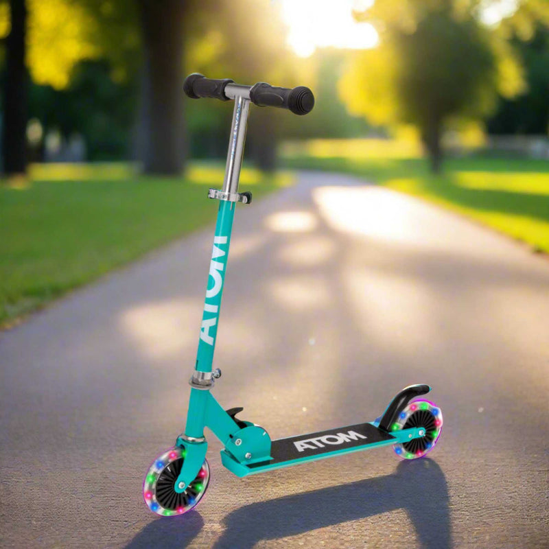 ATOM Inline 2-wheeled children's scooter in a stylish pink camouflage theme, featuring a durable design, eye-catching camouflage patterns, and a trendy look ideal for young riders