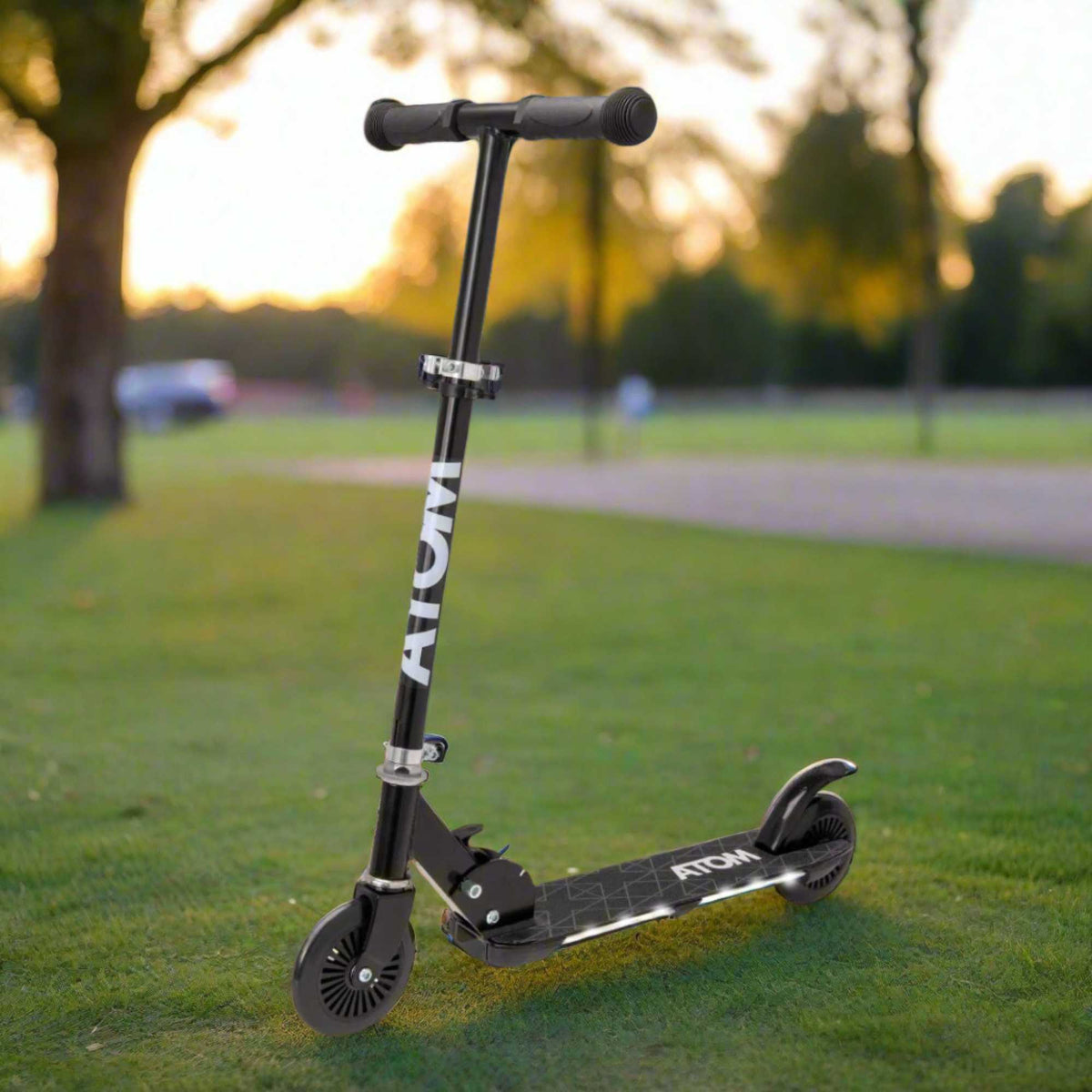 ATOM Night Flash 2-wheeled scooter for kids aged 5 and up, featuring LED light-up wheels, a sturdy frame, and adjustable handlebars, designed for safe and exciting rides.