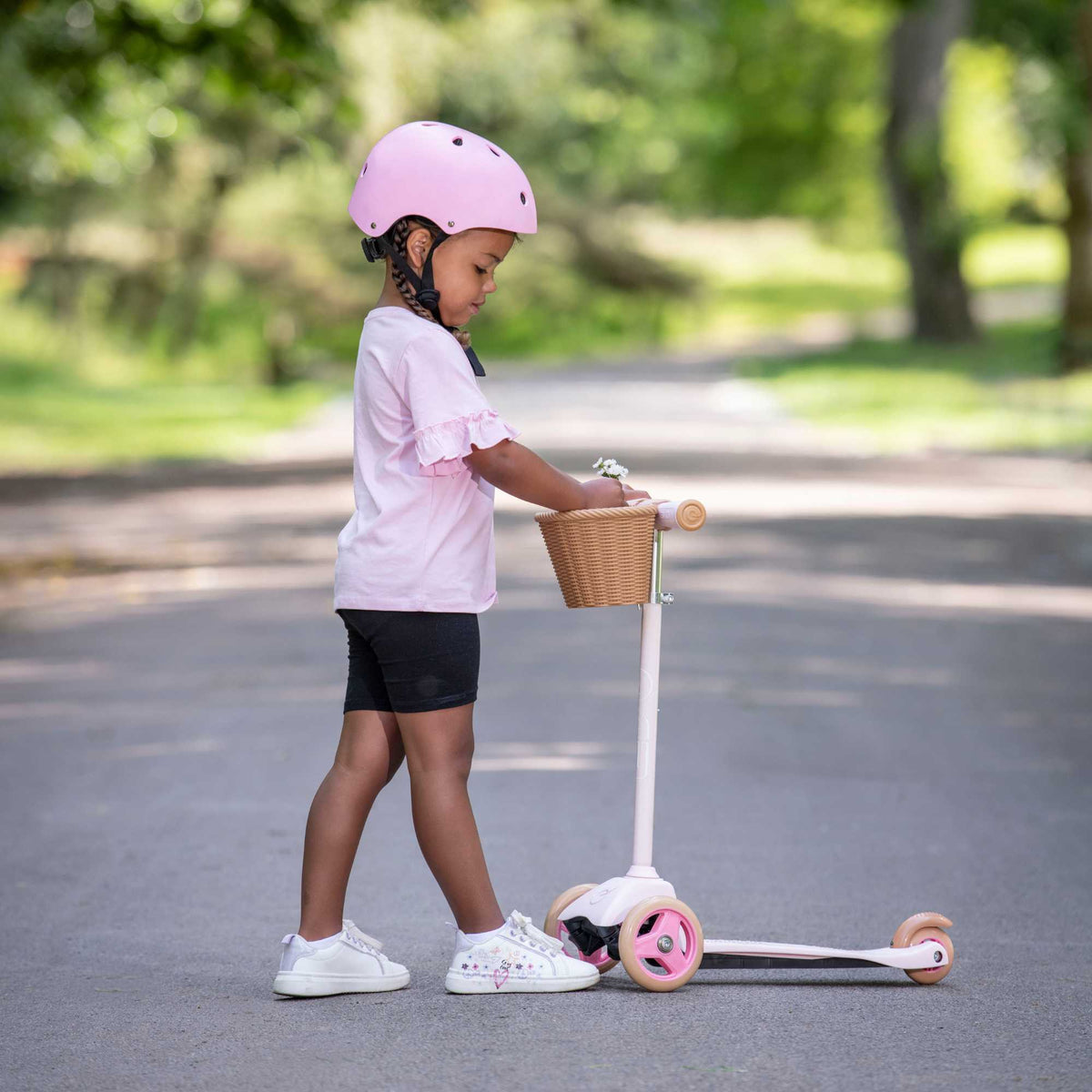 EVO Mini Cruiser Scooter with Basket, featuring a stable three-wheel design, adjustable handlebars, and lightweight, durable construction, perfect for young children’s outdoor adventures.