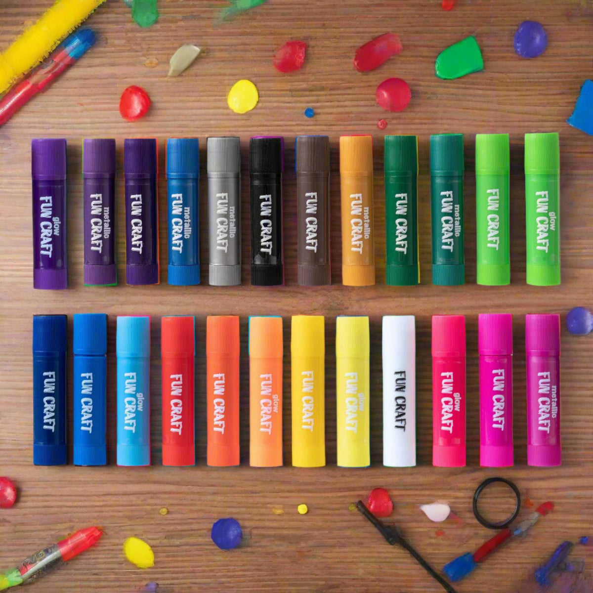 A colorful set of Fun Craft Tempera Paint Sticks, featuring 24 vibrant paint sticks neatly arranged in a plastic tray. The packaging displays the brand name and highlights that the paint sticks are easy to use, mess-free, and suitable for various craft projects.