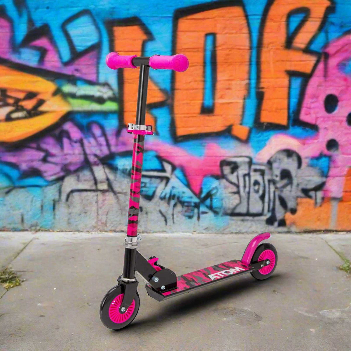 ATOM Inline 2-wheeled children&#39;s scooter in a stylish pink camouflage theme, featuring a durable design, eye-catching camouflage patterns, and a trendy look ideal for young riders