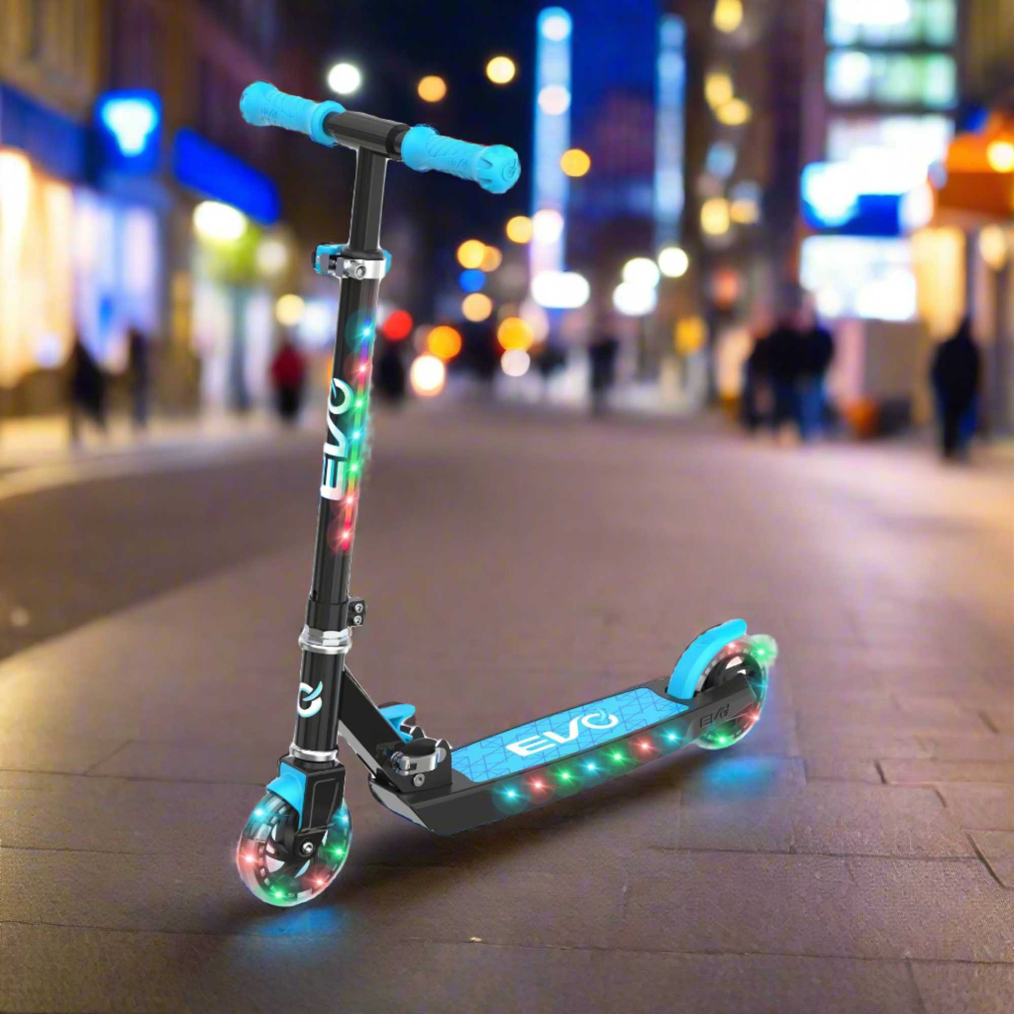 EVO Children's Light Up Light Blast Scooter for Kids Ages 5 and Up with LED Wheels and Adjustable Handlebar , perfect for enhancing motor skills and outdoor fun.