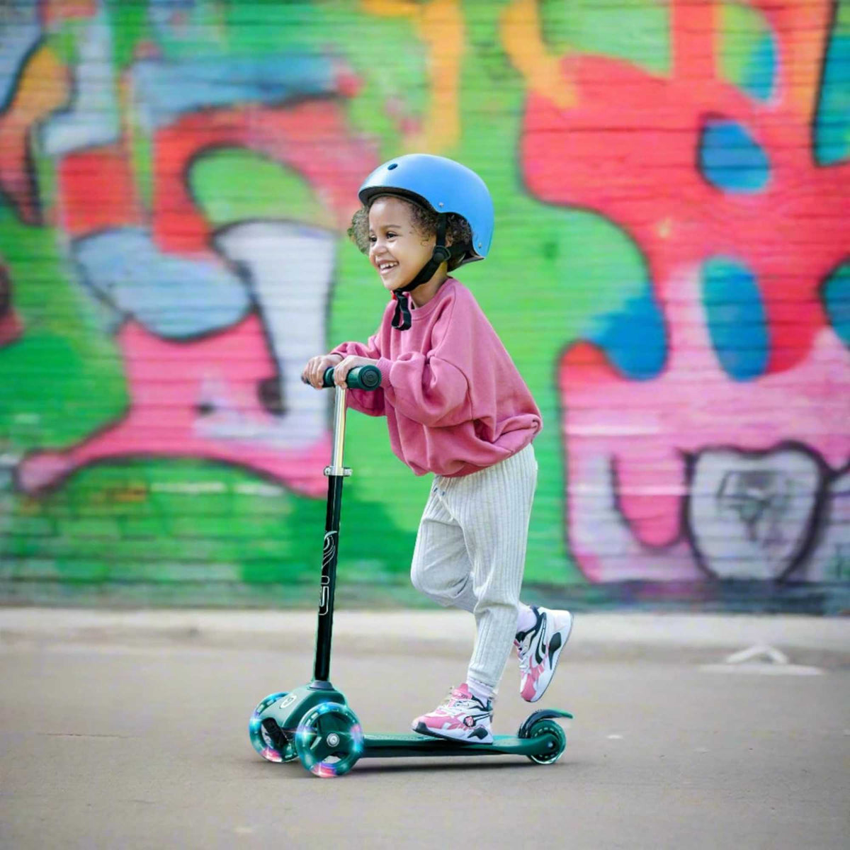 EVO Mini Cruiser Scooter , featuring a stable light up three-wheel design, adjustable handlebars, and lightweight, durable construction, perfect for young children’s outdoor adventures.