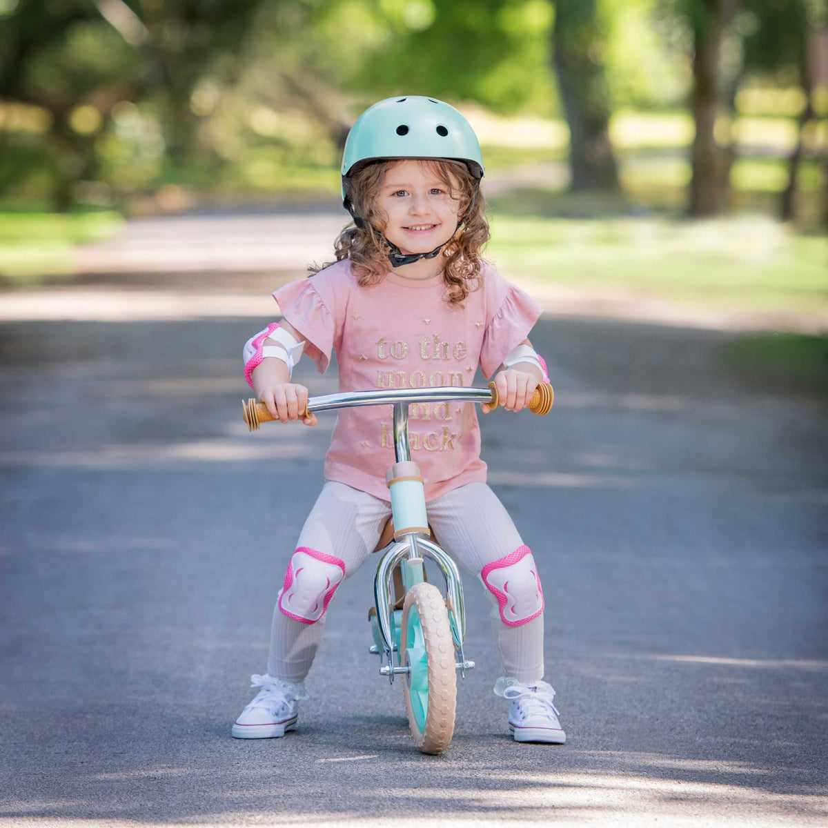 ATOM 10-inch Glider Bike in Mint Green, lightweight kids&#39; balance bicycle with adjustable seat and handlebars.